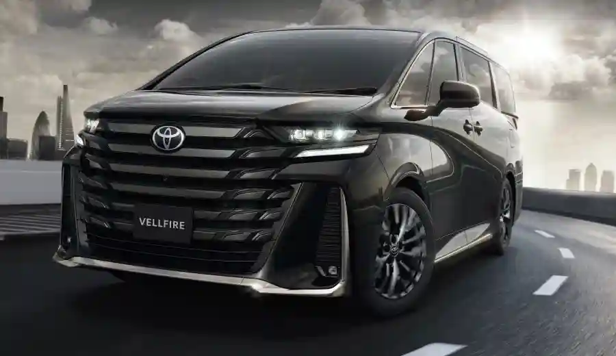 Vellfire on an urban highway at dusk